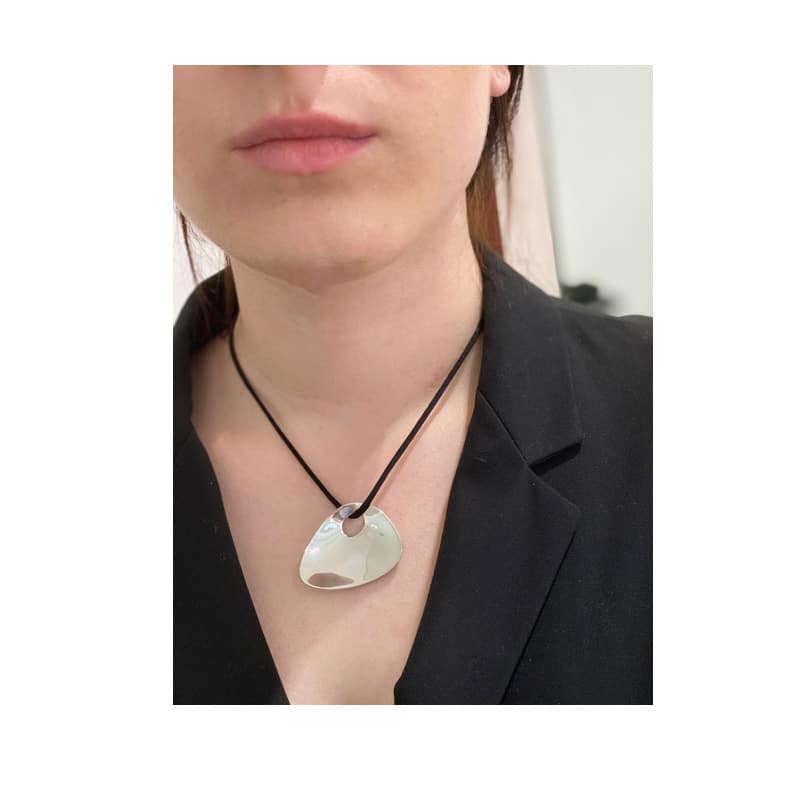 Silver pendant in organic triangular shape